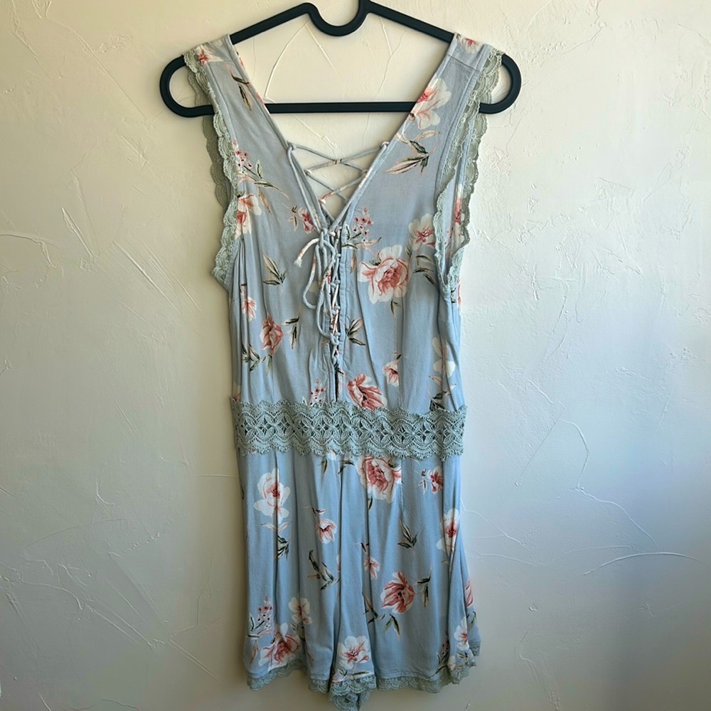 Floral light blue romper with front tie. Size small. Brand- Kendall & Kylie